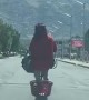 Person Scooters Down Roadway