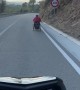 Motorcycle Follows Wheelchair Down Hill