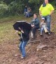 Woman Slips on Muddy Slope