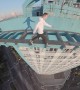 Daredevil Makes Precarious Dash Across  High-Rise Rooftop