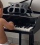 Baby Pianist Takes a Tumble