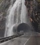 Heavy Rain Creates a Waterfall Over Road