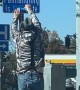 Panhandler Corrects Sign In Front Of Police