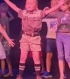 Confident kid has a blast dancing on a stage