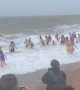Wind, rain and waves for the annual Christmas Day swim on Brighton Beach