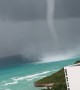 Waterspout Towers Over Shore