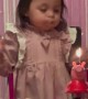 Toddler Tries Her Hardest to Blow Out Birthday Candle