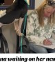 Super-excited pup waits for new mom to fill the adoption papers 