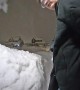 Man Groans After Snow Pile Collapses