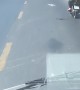 Bird Flies Alongside Motorcyclist