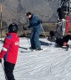 Ski Lift Rider Misses Dismount and Knocks Her Companion Down