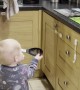 Childproofing Can't Stop Two-Year-Old From Helping in the Kitchen
