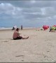 Man Falls Trying to Pass Soccer Ball at the Beach