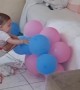 Baby Plays With Balloons
