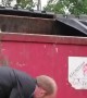 Man Helps Raccoon Stuck Under Dumpster
