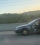 Car Missing All Four Doors Driving on Highway