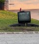 Neighbor's Old Television Ominously Cackles