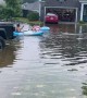 Neighbors Make the Most of Flooded Street