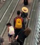 Travelers Have Fun on Moving Walkway at Denver Airport
