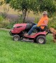Helpful Dog Hops On Lawn Mower