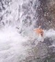 Waterfall Submerges Unsuspecting Swimmer