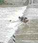 Man Rescues Drowning Dog From Flooding Road