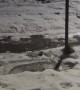 Son Somersaults Safely Down Icy Slope