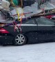 Belongings Strapped Precariously To Sedan Roof