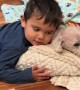 Three-Year-Old Gives Blanket And Hug To Old Dog