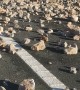 Cleaning Up After Truck Loaded With Stones Overturned