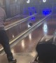 Player Throws Bowling Ball Across Lanes