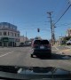 Backward Driver Speeds Through Red Light