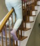 Playful Nan Slides Backward Down Banister