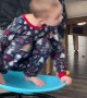 Child Whirls Around On Spin Chair