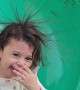 Girl Has Hair-Raising Fun on Slide