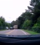 Driver Attempts Passing Truck on Blind Corner