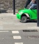 Man Drives Toy Car On London Sidewalk