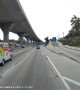 Person Throws a Large Rock on the Freeway