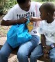 Monkey Snatches Chips From a Boy at a Park