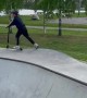 Boy Faceplants While Scootering In Skatepark