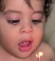 Little Boy Trying His Best to Blow Out Candles