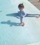 Baby's First Dip In the Pool