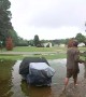 UPS Driver Delivers Heavy Package Through Flooded Yard