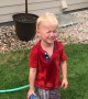 Three-Year-Old Keeps Spraying Himself With Water Hose