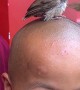 Bird Gets Fed on Little Monk's Head