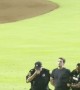 Stumbling Fan Escorted Off Baseball Field