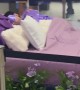 Man Sleeps On Mall Mattress Display