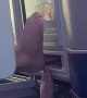 Dude Using Bare Feet to Use Airplane Screen