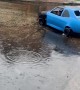 Miniature Car Goes For Rainy Cruise