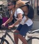 Dog on Owner's Back Riding a Bike